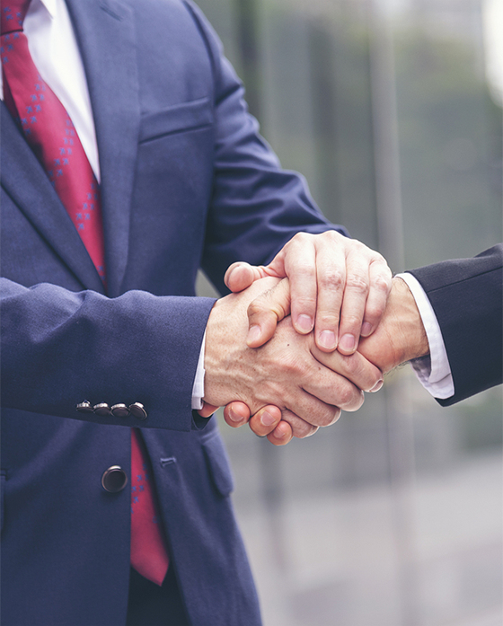 Two lawyers are shaking their hands Two lawyers are shaking their hands